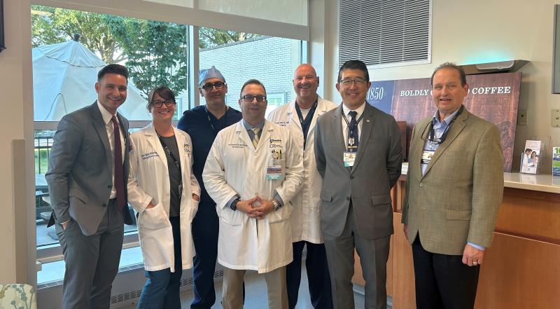 Gathered in recognition of the milestone 200th TAVR procedure are (l-r) Tom Trobiano, executive director, cardiovascular, neuroscience and clinical operations; Annie Villalobos; Dr. Mouhanad Freih; Dr. Paul Sierzenski, chief physician executive; Dr. Steven Marra; Dr. David Tam, Beebe Healthcare president and CEO; and Paul Peet, MD, Beebe medical staff president. SUBMITTED PHOTO
